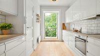 modern white minimalistic kitchen with a balcony